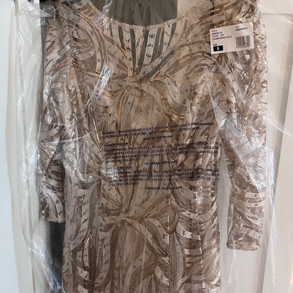 Long sequined dress made by Tahari.  Size 8. Never worn